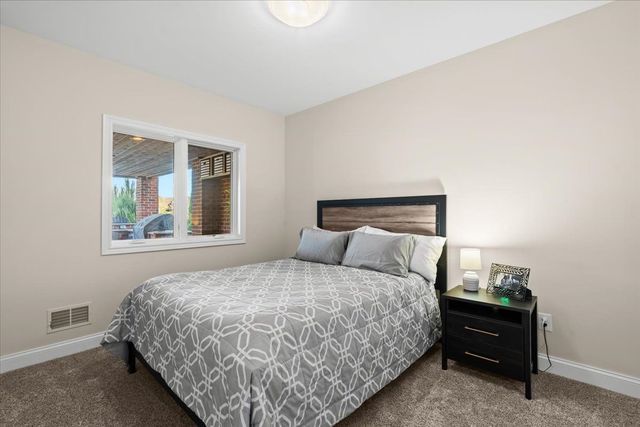 8353 Pier Point Ct, South Lyon, MI 48178 - carpeted bedroom with baseboards
