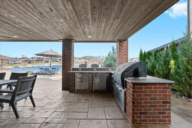 8353 Pier Point Ct, South Lyon, MI 48178 - view of patio / terrace with area for grilling, outdoor dining space, a water view, and a grill