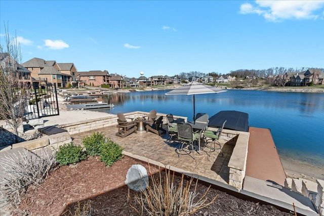 8353 Pier Point Ct, South Lyon, MI 48178 - dock area featuring a water view and a residential view