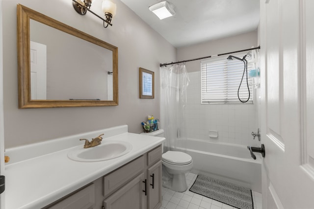 full bathroom with tile patterned floors, toilet, vanity, and shower / bath combo with shower curtain