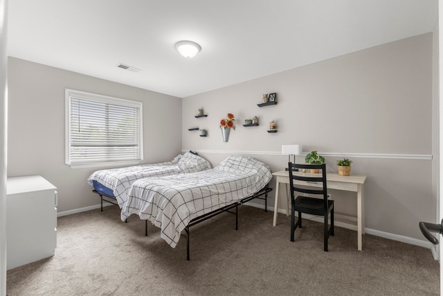 bedroom featuring carpet floors and baseboards