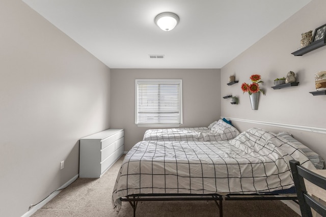 bedroom with light colored carpet