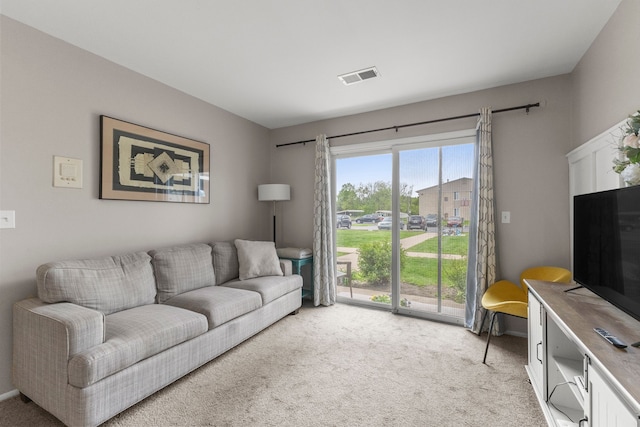 living room featuring light colored carpet