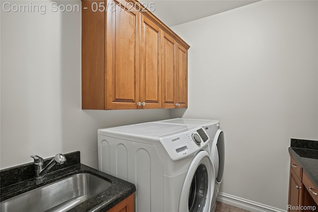 3074 Pond Rd, Leonard, MI 48367 - laundry area featuring cabinet space, washer and clothes dryer, and baseboards