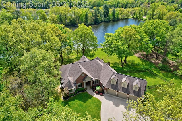 3074 Pond Rd, Leonard, MI 48367 - aerial view of property and surrounding area featuring a nearby body of water and a heavily wooded area