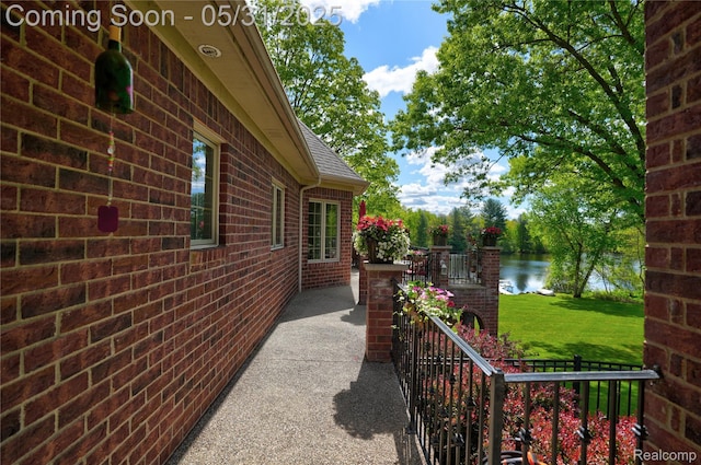 3074 Pond Rd, Leonard, MI 48367 - view of patio / terrace with a water view