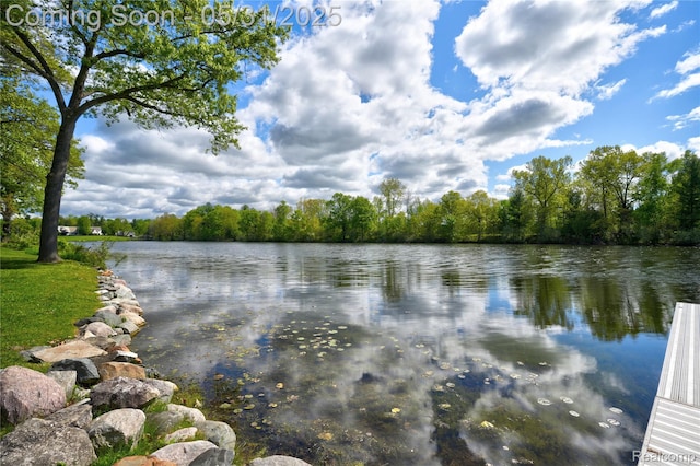 3074 Pond Rd, Leonard, MI 48367 - water view with a heavily wooded area