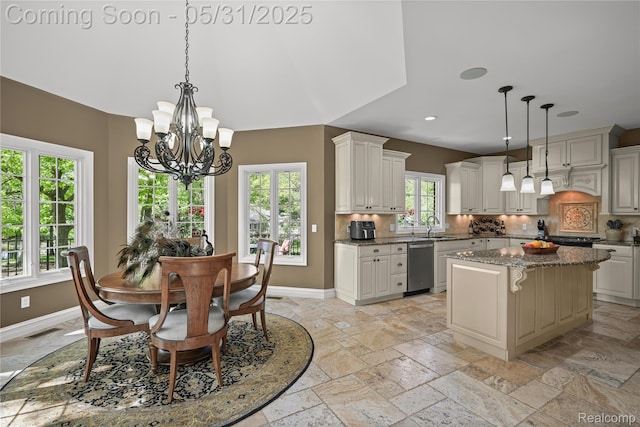 3074 Pond Rd, Leonard, MI 48367 - kitchen with baseboards, tasteful backsplash, a center island, a chandelier, and recessed lighting