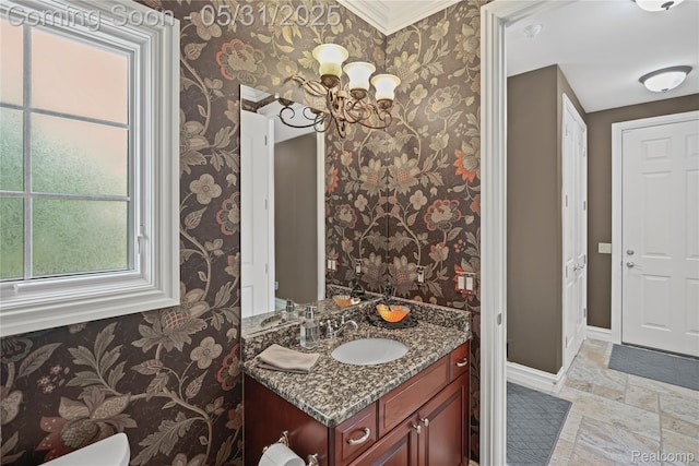 3074 Pond Rd, Leonard, MI 48367 - half bathroom with wallpapered walls, toilet, vanity, baseboards, and stone tile floors