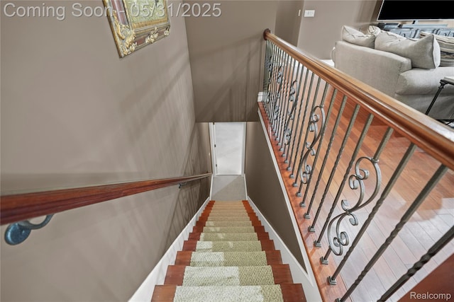 3074 Pond Rd, Leonard, MI 48367 - stairs with wood finished floors