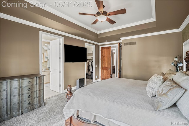 3074 Pond Rd, Leonard, MI 48367 - bedroom featuring ornamental molding, a walk in closet, connected bathroom, a closet, and a raised ceiling