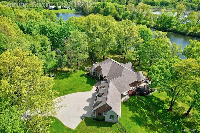 3074 Pond Rd, Leonard, MI 48367 - view from above of property featuring a large body of water and a heavily wooded area