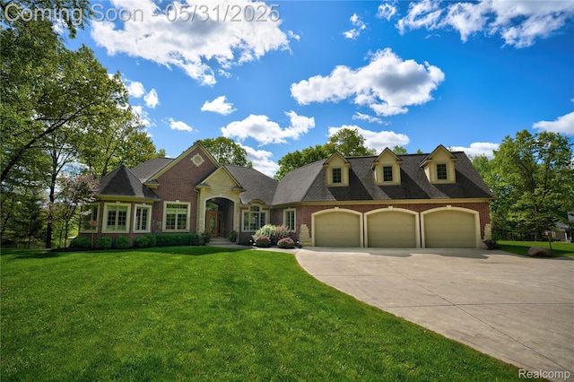 3074 Pond Rd, Leonard, MI 48367 - view of front facade featuring an attached garage, driveway, brick siding, and a front lawn