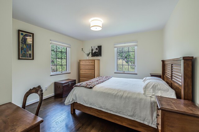 2124 Brockman Blvd, Ann Arbor, MI 48104 - bedroom with dark wood-style flooring and baseboards