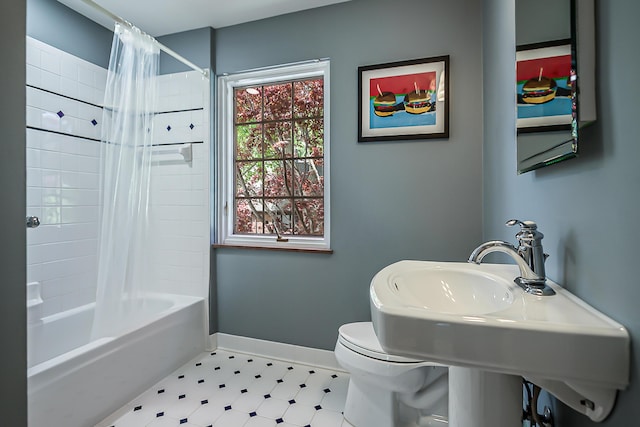 2124 Brockman Blvd, Ann Arbor, MI 48104 - bathroom with tile patterned floors, baseboards, toilet, and shower / tub combo