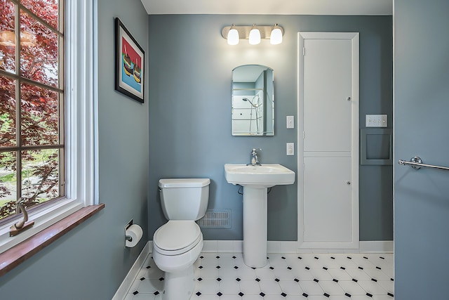 2124 Brockman Blvd, Ann Arbor, MI 48104 - bathroom featuring baseboards, toilet, and tile patterned floors