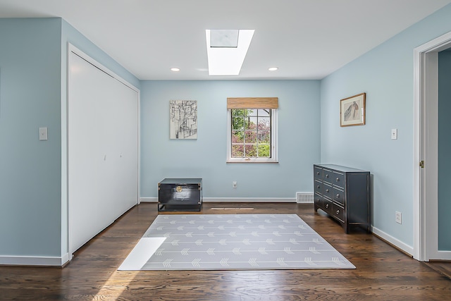 2124 Brockman Blvd, Ann Arbor, MI 48104 - living area with dark wood-style floors, a skylight, baseboards, and recessed lighting