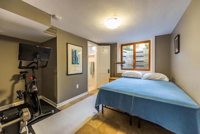 2124 Brockman Blvd, Ann Arbor, MI 48104 - bedroom featuring ensuite bathroom and baseboards