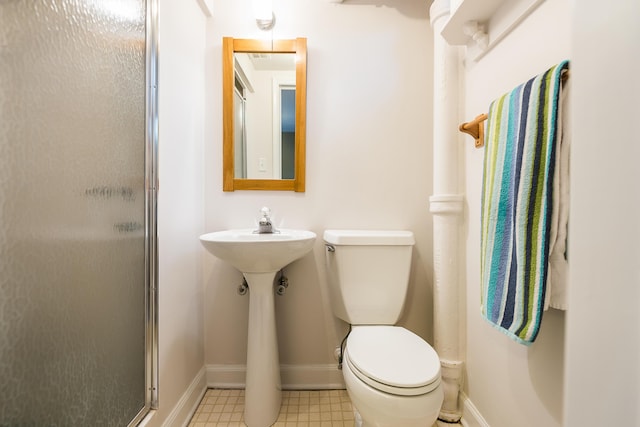 2124 Brockman Blvd, Ann Arbor, MI 48104 - bathroom with baseboards, toilet, a shower stall, and tile patterned floors