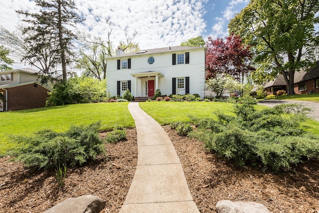 2124 Brockman Blvd, Ann Arbor, MI 48104 - colonial inspired home with a chimney and a front yard