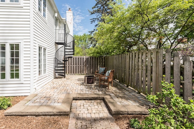 2124 Brockman Blvd, Ann Arbor, MI 48104 - view of patio / terrace featuring an outdoor fire pit, stairs, and fence