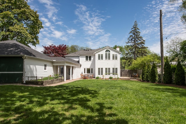 2124 Brockman Blvd, Ann Arbor, MI 48104 - back of house with a patio, a chimney, and a garden