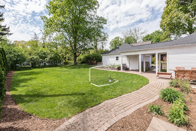 2124 Brockman Blvd, Ann Arbor, MI 48104 - view of grassy yard with a patio area