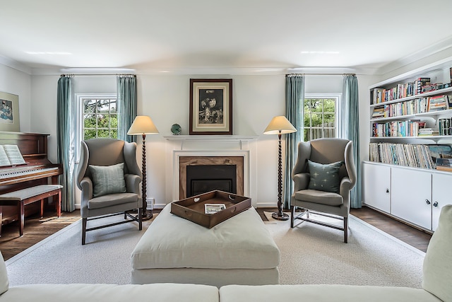 2124 Brockman Blvd, Ann Arbor, MI 48104 - living area featuring a fireplace, wood finished floors, and crown molding