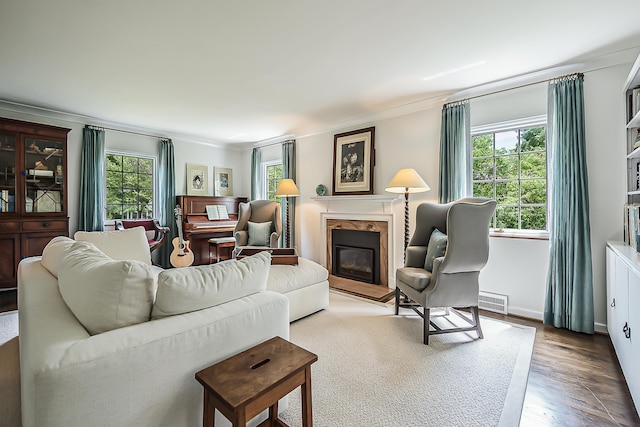 2124 Brockman Blvd, Ann Arbor, MI 48104 - living area with a fireplace, wood finished floors, crown molding, and baseboards