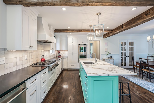2124 Brockman Blvd, Ann Arbor, MI 48104 - kitchen with custom range hood, a sink, appliances with stainless steel finishes, beamed ceiling, and a chandelier