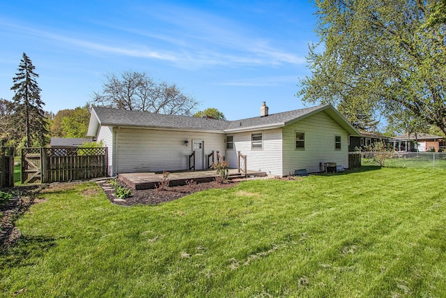 2151 Brown School Rd, Saint Joseph, MI 49085 - back of property with a wooden deck and a chimney