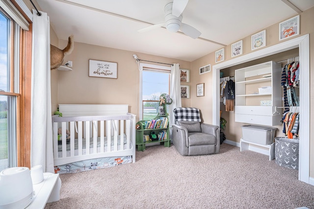 carpeted bedroom featuring baseboards and ceiling fan