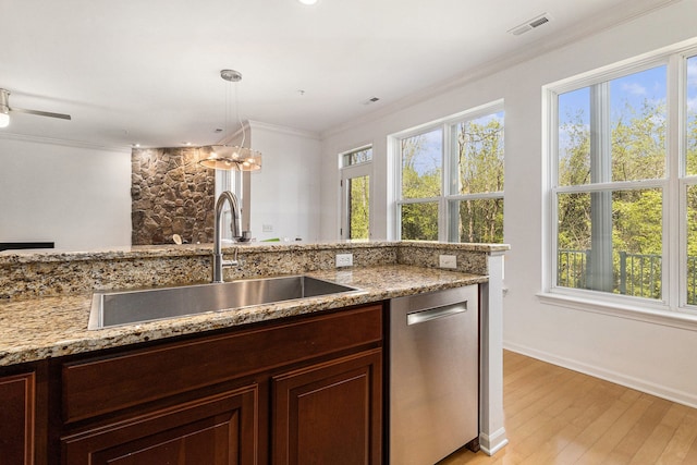 3203 Asher Rd, Ann Arbor, MI 48104 - kitchen with dishwasher, a sink, plenty of natural light, light wood-style floors, and crown molding