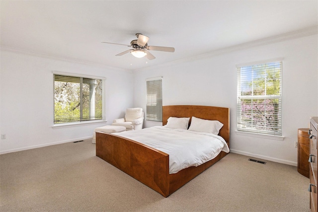 3203 Asher Rd, Ann Arbor, MI 48104 - bedroom featuring crown molding, multiple windows, light carpet, and baseboards