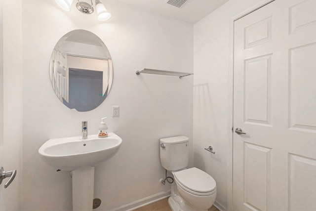 3203 Asher Rd, Ann Arbor, MI 48104 - half bath featuring toilet and baseboards