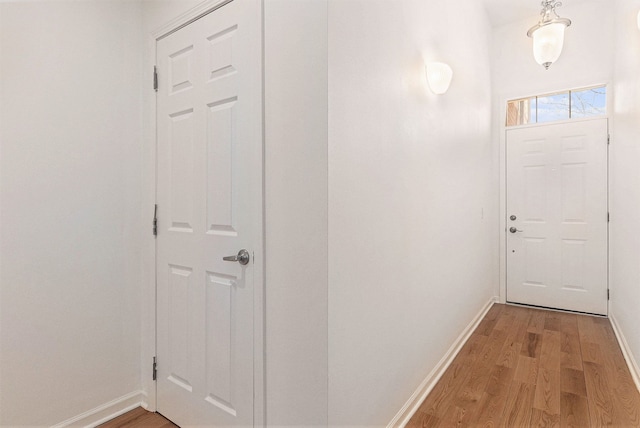3203 Asher Rd, Ann Arbor, MI 48104 - doorway with baseboards and light wood-style floors