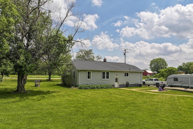 11010 N Holly Rd, Holly, MI 48442 - back of property with a yard and a chimney