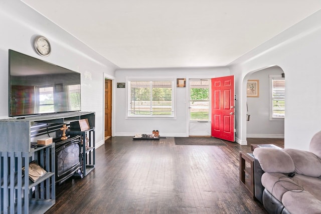 11010 N Holly Rd, Holly, MI 48442 - living area with wood-type flooring, arched walkways, and baseboards