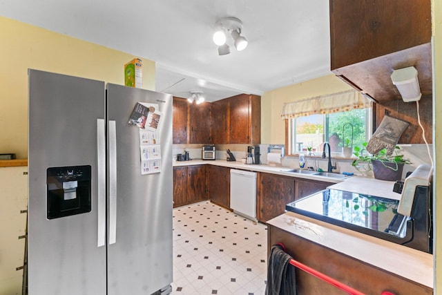 11010 N Holly Rd, Holly, MI 48442 - kitchen featuring stainless steel fridge with ice dispenser, a sink, dishwasher, light countertops, and dark brown cabinets