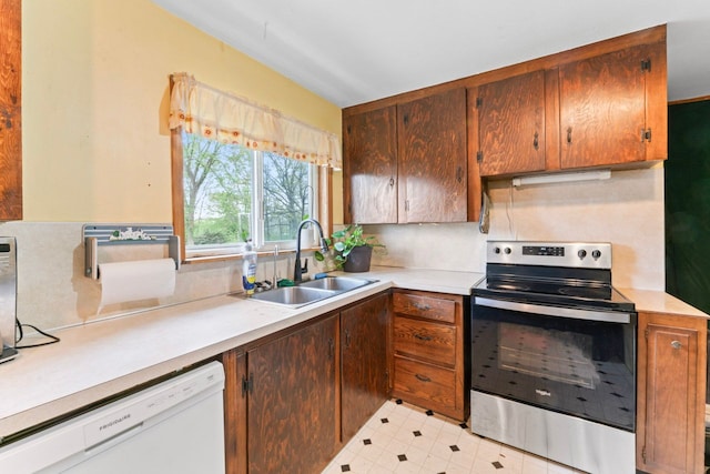 11010 N Holly Rd, Holly, MI 48442 - kitchen with stainless steel electric range, dishwasher, a sink, and light countertops