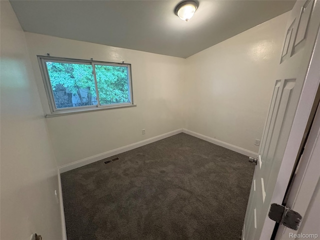 29592 Fairfax St, Southfield, MI 48076 - unfurnished room featuring dark colored carpet and baseboards