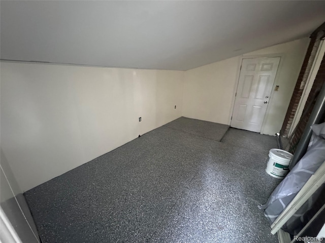 29592 Fairfax St, Southfield, MI 48076 - unfurnished living room featuring vaulted ceiling