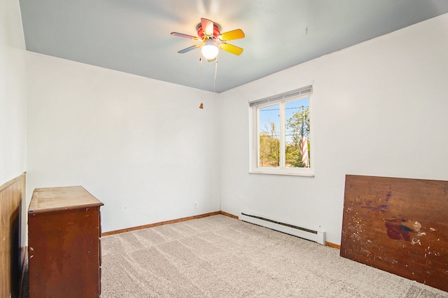 102 Franklin St, Holly, MI 48442 - unfurnished room with a baseboard heating unit, light colored carpet, ceiling fan, and baseboards
