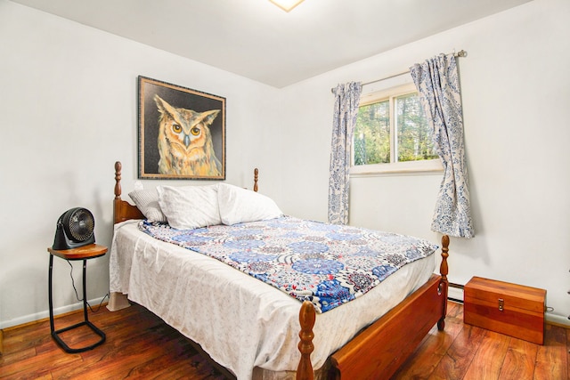 102 Franklin St, Holly, MI 48442 - bedroom with wood-type flooring, baseboards, and baseboard heating