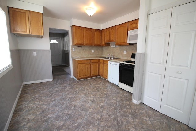 11436 Syracuse St, Taylor, MI 48180 - kitchen featuring white appliances, a sink, light countertops, brown cabinets, and baseboards