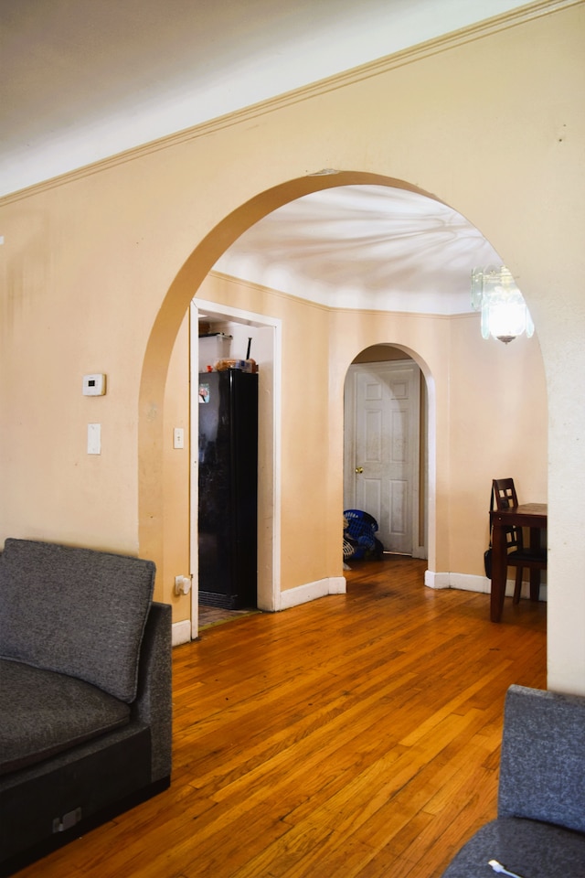 10039 Mark Twain St, Detroit, MI 48227 - hall with wood-type flooring, arched walkways, and baseboards