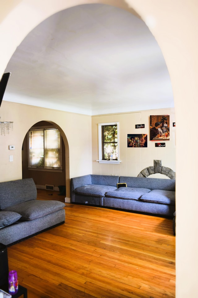 10039 Mark Twain St, Detroit, MI 48227 - living room with arched walkways and wood finished floors