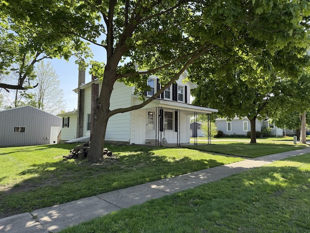 202 Kalamo St, Olivet, MI 49076 - view of front of home with a chimney and a front lawn