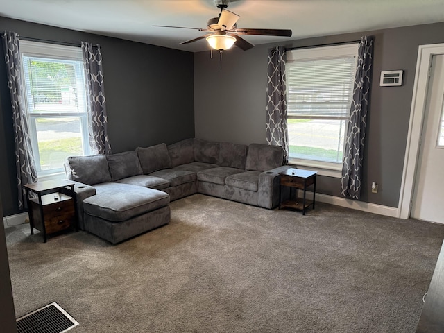202 Kalamo St, Olivet, MI 49076 - carpeted living room with ceiling fan and baseboards