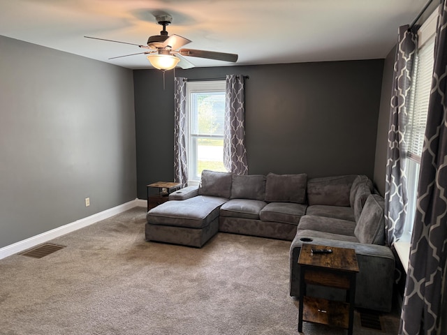 202 Kalamo St, Olivet, MI 49076 - carpeted living room featuring ceiling fan and baseboards